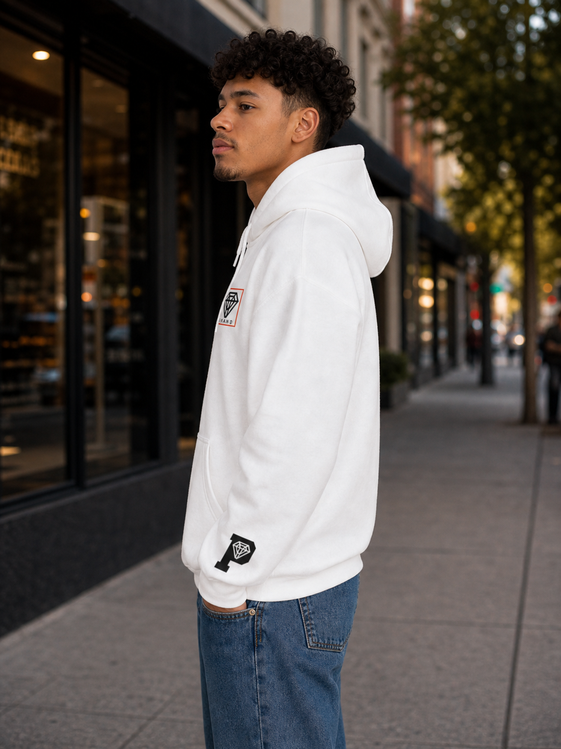 Signature Logo Hoodie in White left side lifestyle product image showing sleeve icon